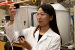 A Georgia Tech researcher examines a component of a direct air capture system that employs carbon fiber strands. Direct air capture systems require chemical materials that can grab carbon dioxide.