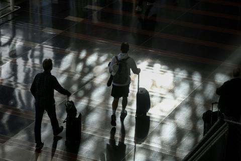 Passengers walk through the Ronald Reagan Washington National Airport on Nov. 7, 2025. Anna Moneymaker/Getty Images