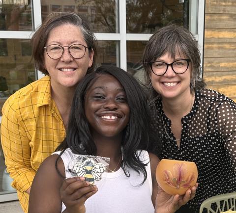 Left to right: Beekeeper in Residence Deb DeWitt, alumna Tosin Adedipe (BME 2025), and Jennifer Leavey, assistant dean for faculty mentoring in the College of Sciences and director of the Urban Honey Bee Project