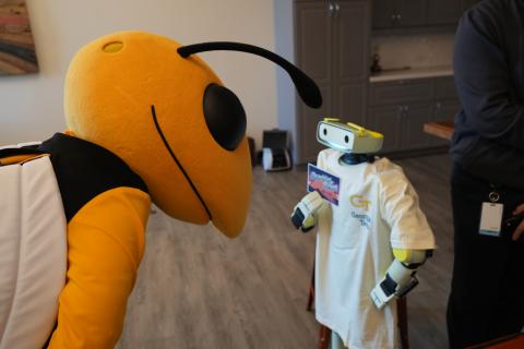 Buzz, the Georgia Tech mascot, meets a Sprout robot.