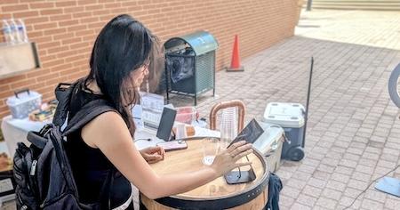 A student enters her selection with VinoBarrel, which serves juice and flavored tea during all-ages product demos.